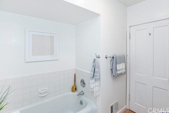 1446 North Harding Avenue Pasadena, CA 91104 - Photo 16 of 26 a bathroom with a tub and a shower