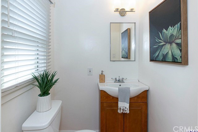 1446 North Harding Avenue Pasadena, CA 91104 - Photo 18 of 26 a bathroom with a toilet sink and mirror