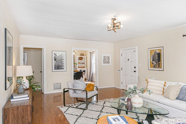 1446 North Harding Avenue Pasadena, CA 91104 - Photo 4 of 26 a living room with furniture a rug and a chandelier