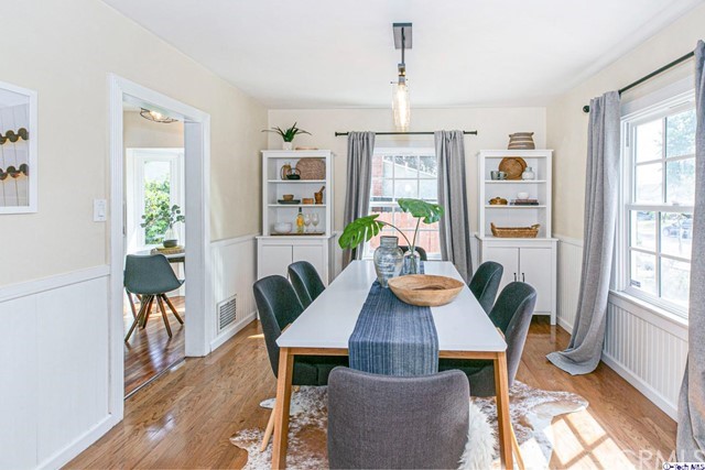 1446 North Harding Avenue Pasadena, CA 91104 - Photo 6 of 26 a view of a dining room with furniture a potted plant and wooden floor