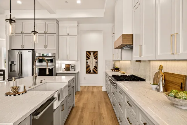 a dining room with wooden floor and a rug