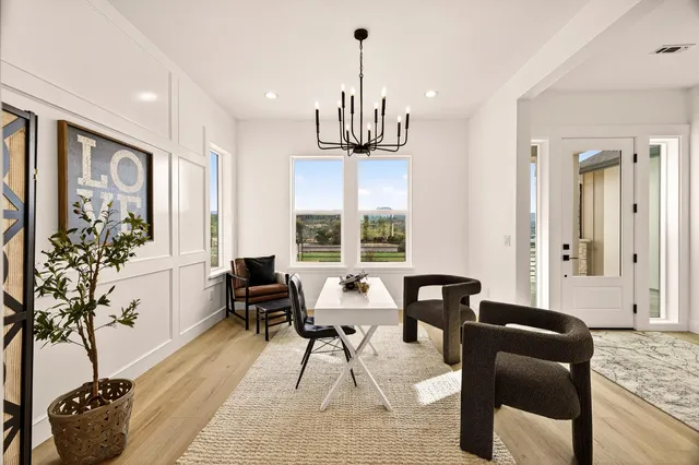 a bathroom with a sink a potted plant and a mirror