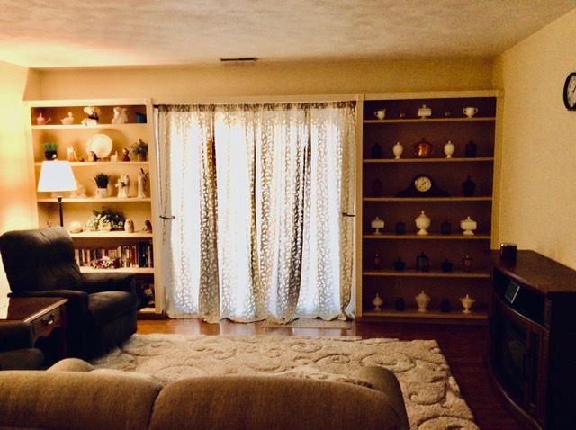 23 Cherry Hill, Unit 124 Hampton, IL 61256 - Photo 14 of 25 a bedroom with a bed and a closet with wooden floor