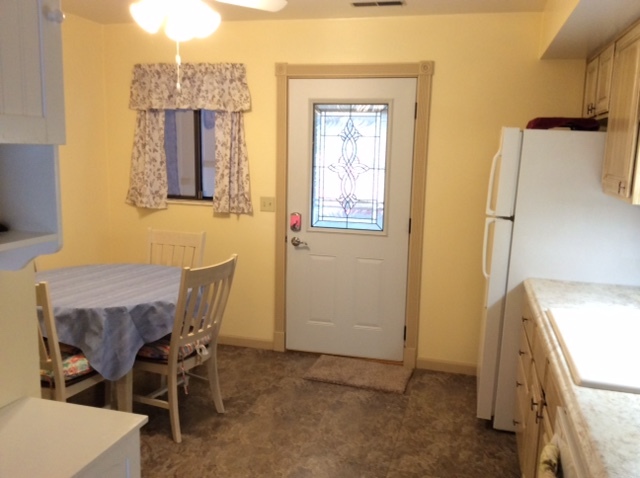 23 Cherry Hill, Unit 124 Hampton, IL 61256 - Photo 20 of 25 a view of a dining room with furniture and a window