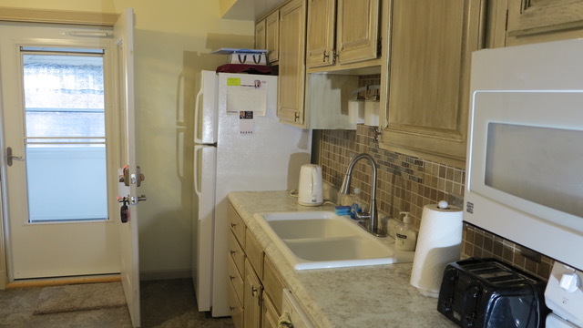23 Cherry Hill, Unit 124 Hampton, IL 61256 - Photo 10 of 25 a bathroom with a sink a toilet and shower