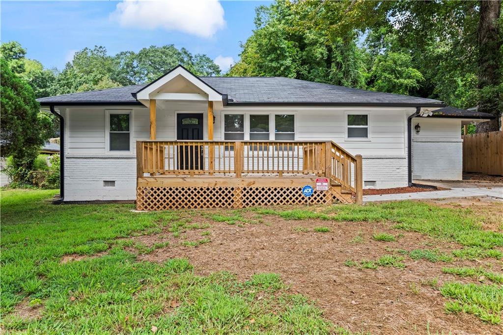 2297 Sheryl Drive Decatur, GA 30032 - Photo 1 of 1 a front view of a house with a garden