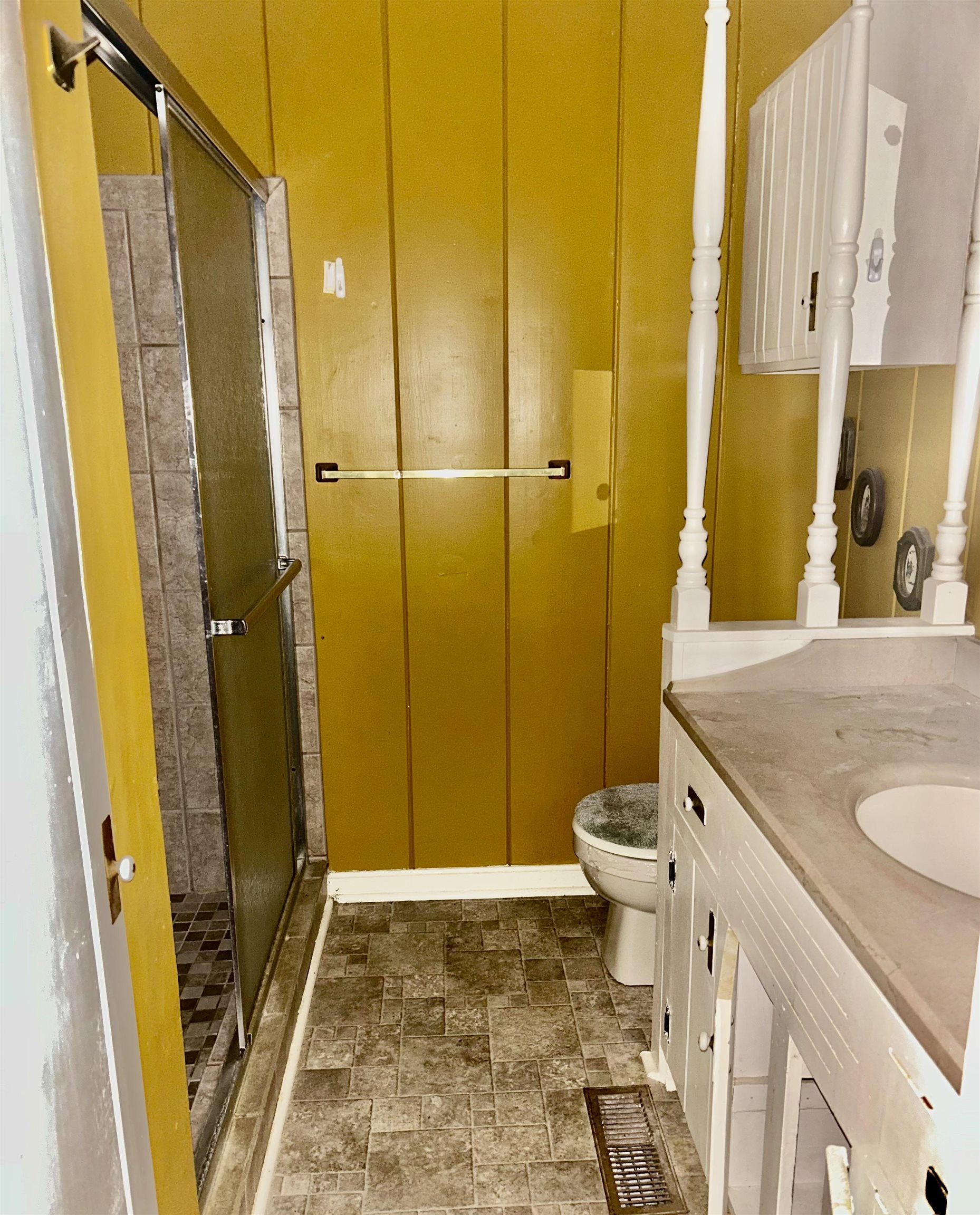 503 Terrace Drive Covington, TN 38019 - Photo 12 of 14 Bathroom featuring a stall shower, stone finish floors, and vanity