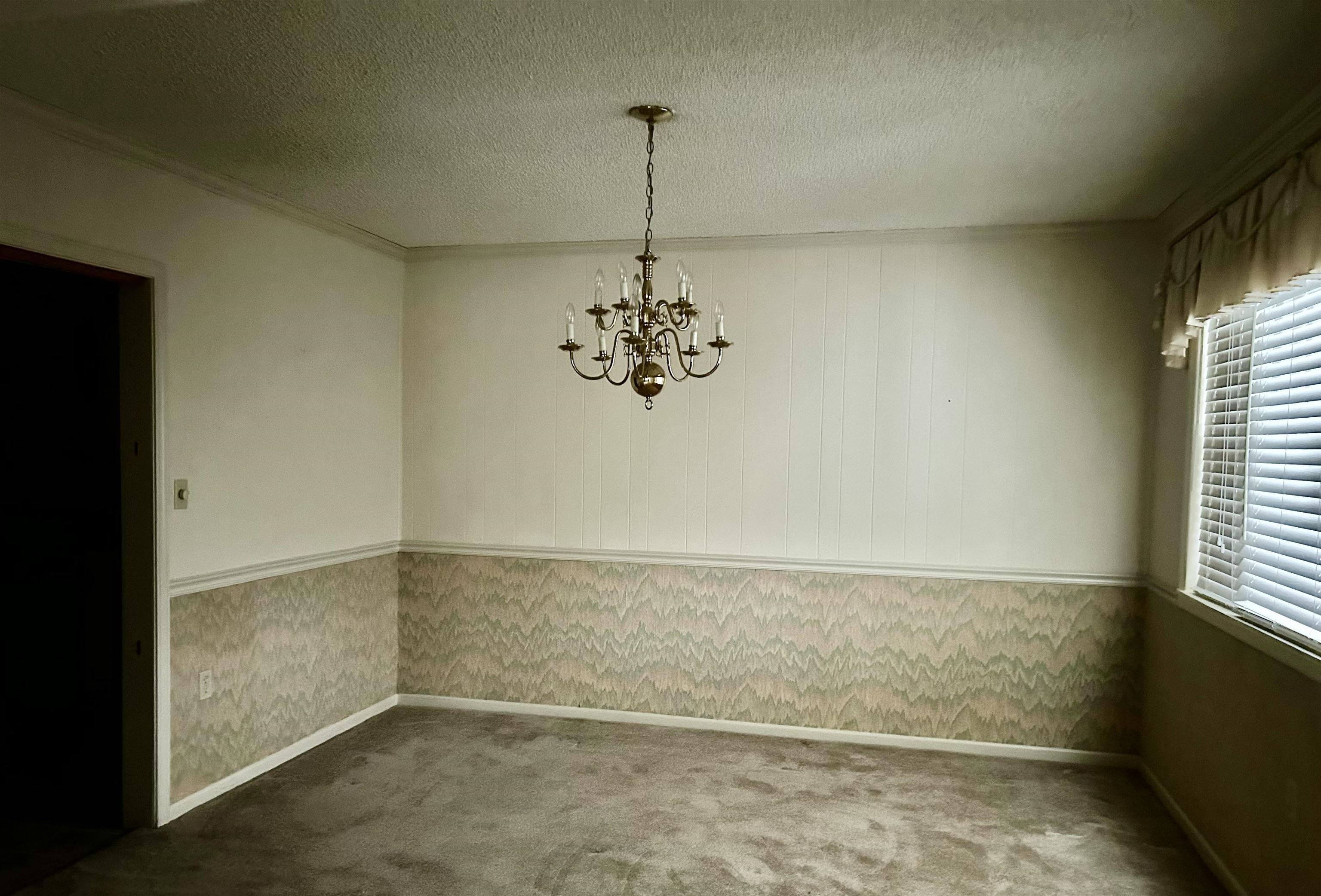 503 Terrace Drive Covington, TN 38019 - Photo 6 of 14 dining area featuring a chandelier, a textured ceiling, and carpet flooring