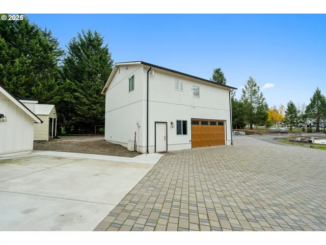 a view of a park with plants and a bench