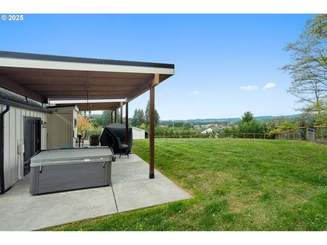 a view of a house with a yard and garage