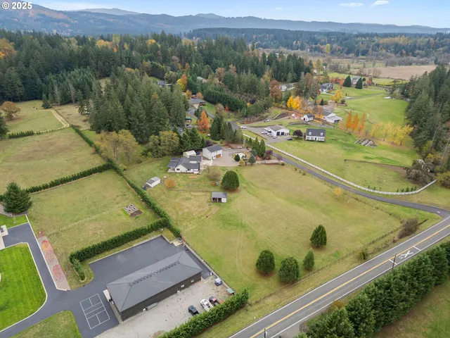 a view of a lake with lawn chairs