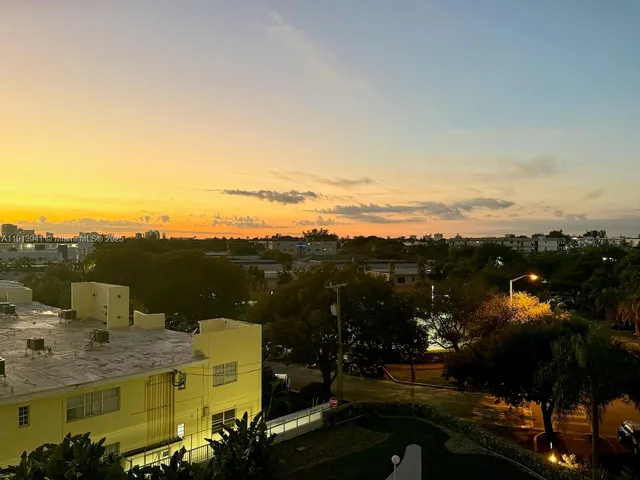 a view of a terrace with a table and chairs