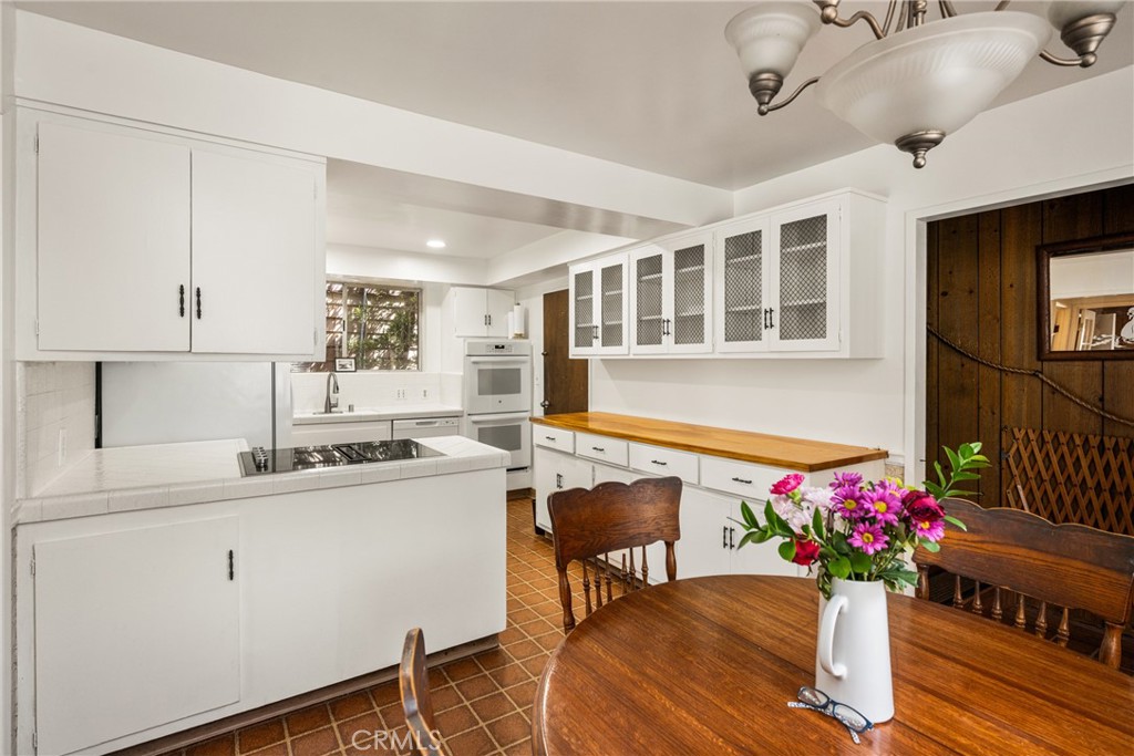 58 Surfside Avenue Surfside, CA 90743 - Photo 13 of 36 a kitchen with a sink and cabinets