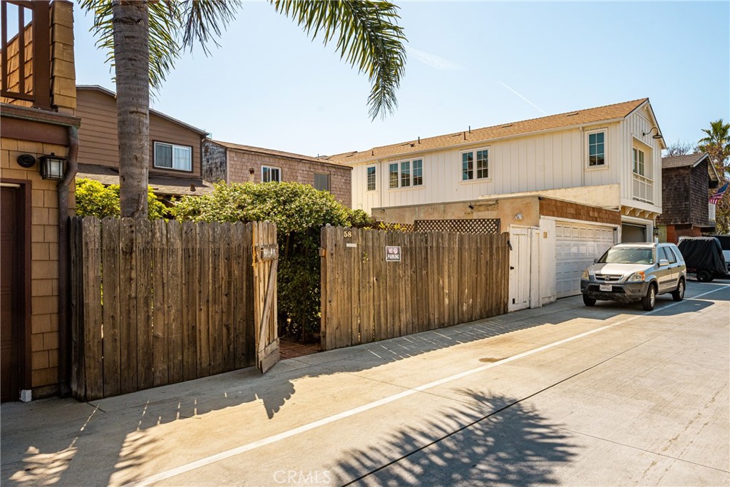 58 Surfside Avenue Surfside, CA 90743 - Photo 28 of 36 a car parked in front of a house