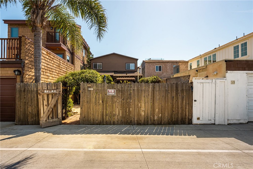 58 Surfside Avenue Surfside, CA 90743 - Photo 29 of 36 a view of a house with a patio