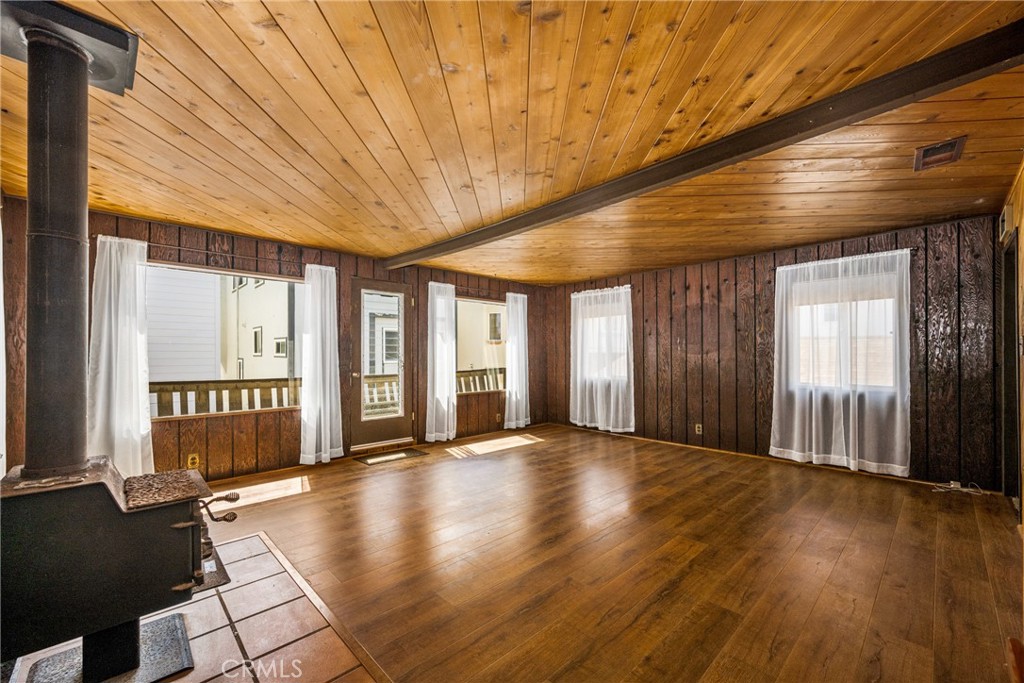 58 Surfside Avenue Surfside, CA 90743 - Photo 7 of 36 a view of an empty room with wooden floor and a window