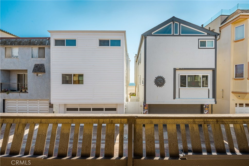 58 Surfside Avenue Surfside, CA 90743 - Photo 8 of 36 a view of a house with wooden fence