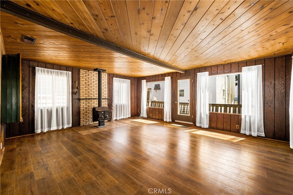 58 Surfside Avenue Surfside, CA 90743 - Photo 10 of 36 a view of an empty room with wooden floor and a window