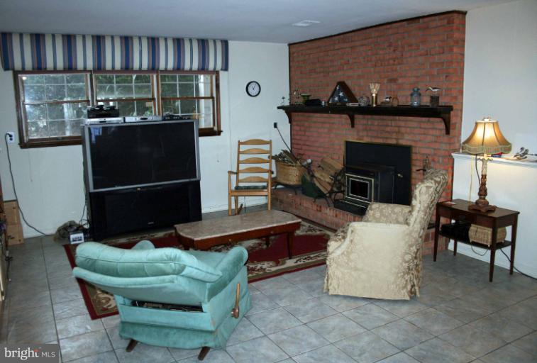 1114 West Joppa Road Towson, MD 21204 - Photo 15 of 22 walk-out Family Room w/Wood Stove insert