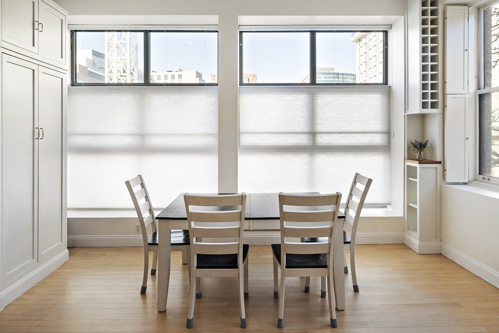 1 Garden Street, Unit FOUR Boston, MA 02114 - Photo 3 of 14 a view of a dining room with furniture and a window