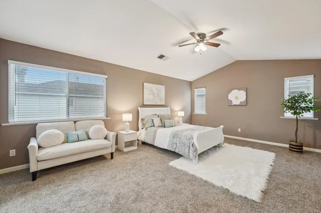 a bed room with a bed and a couch