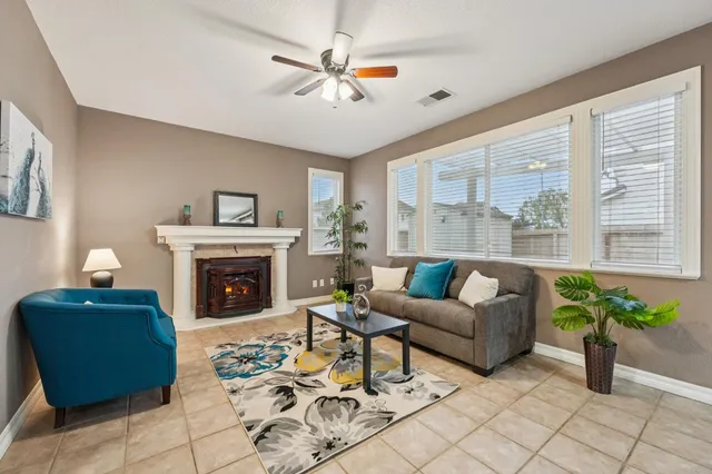 a living room with furniture and a fireplace