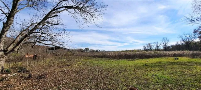 a view of a lake with houses in the back