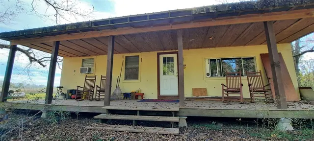 a front view of house with outdoor seating