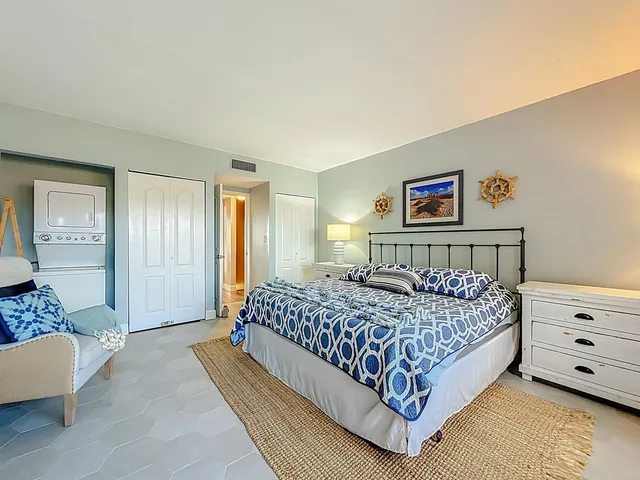 a bedroom with a bed and a couch