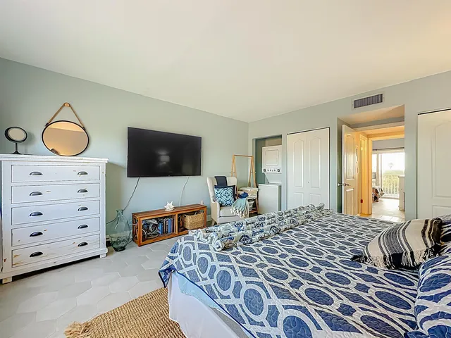 a bedroom with a bed and a dresser