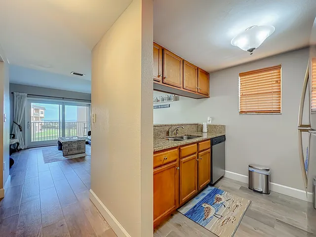 a kitchen with stainless steel appliances granite countertop a stove and a refrigerator