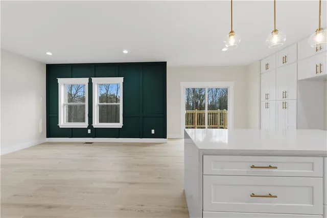 a view of an entryway with wooden floors