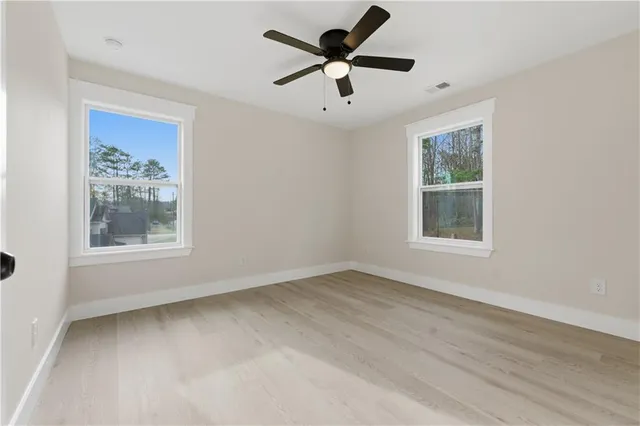 a view of a room with wooden floor and closet