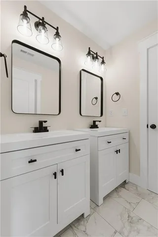 a white bath tub sitting next to a toilet