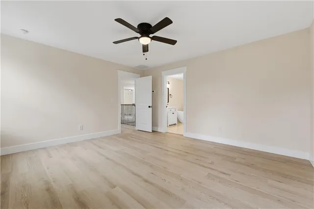 a bath room with a sink and mirror
