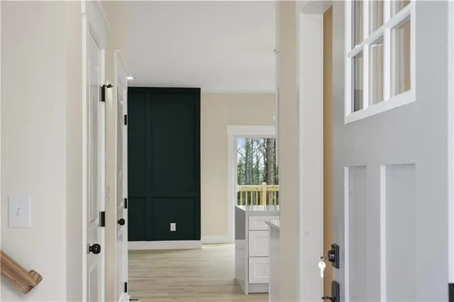 a view of gallery with wooden floor
