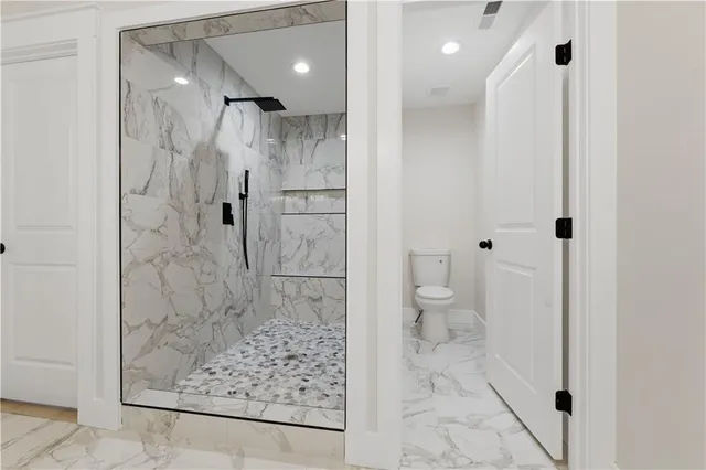 a view of an empty room with windows