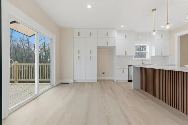 a view of a kitchen with a sink and a window