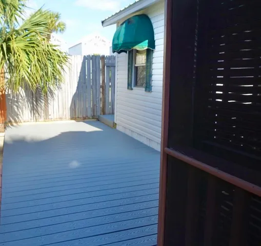 an aerial view of multiple houses with yard