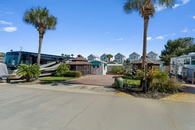 a view of a house with a yard and a garden