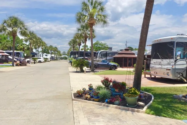 a swimming pool with outdoor seating and a garden