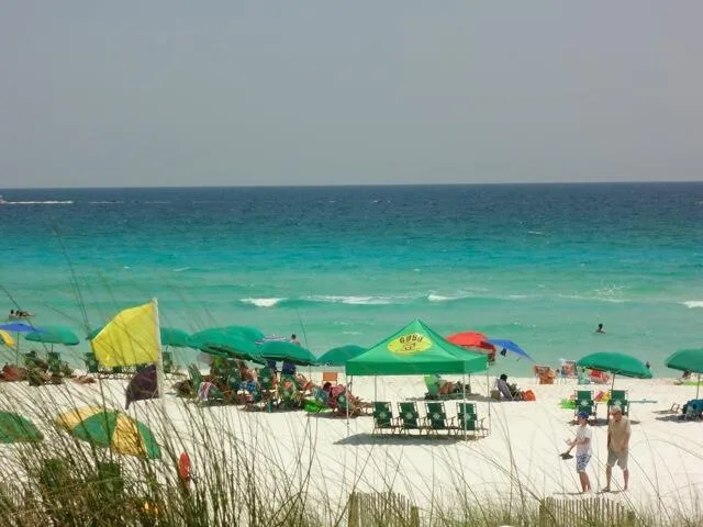 a city street with cars parked in front of it