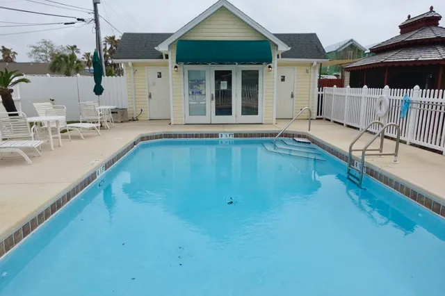 a view of a chairs and tables in the patio