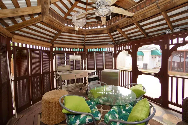 a view of a dry yard with wooden fence