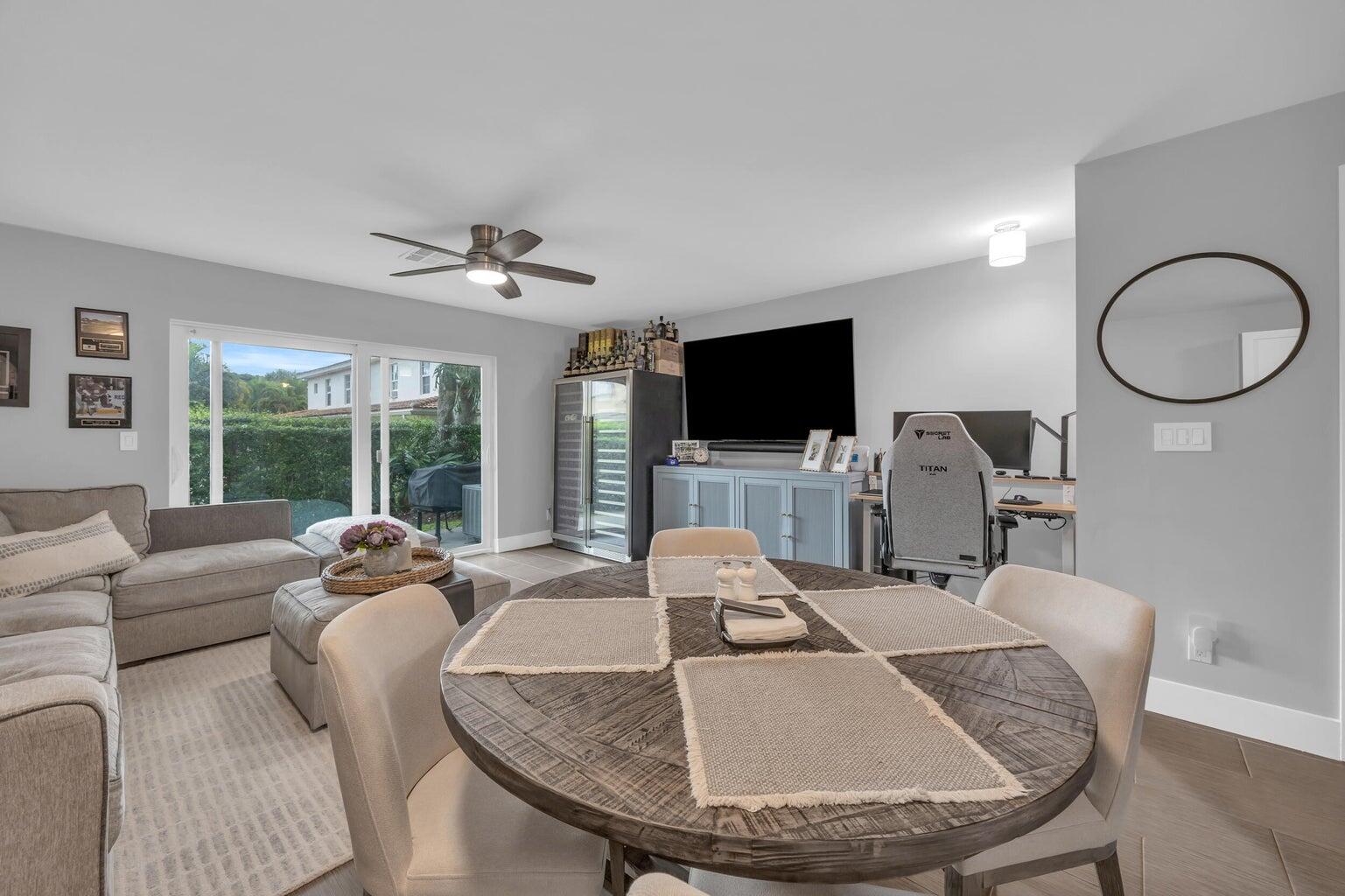 170 Timberwalk Trail Jupiter, FL 33458 - Photo 11 of 28 a living room with furniture and a flat screen tv