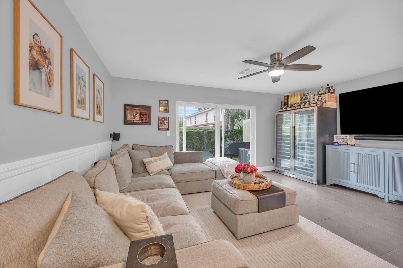 170 Timberwalk Trail Jupiter, FL 33458 - Photo 12 of 28 a living room with furniture and a flat screen tv