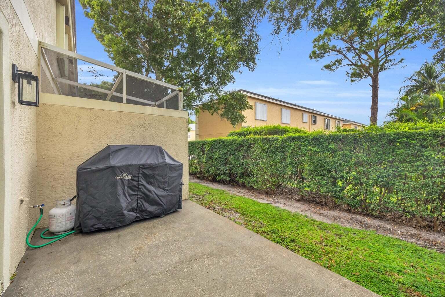 170 Timberwalk Trail Jupiter, FL 33458 - Photo 27 of 28 a front view of a house with garden
