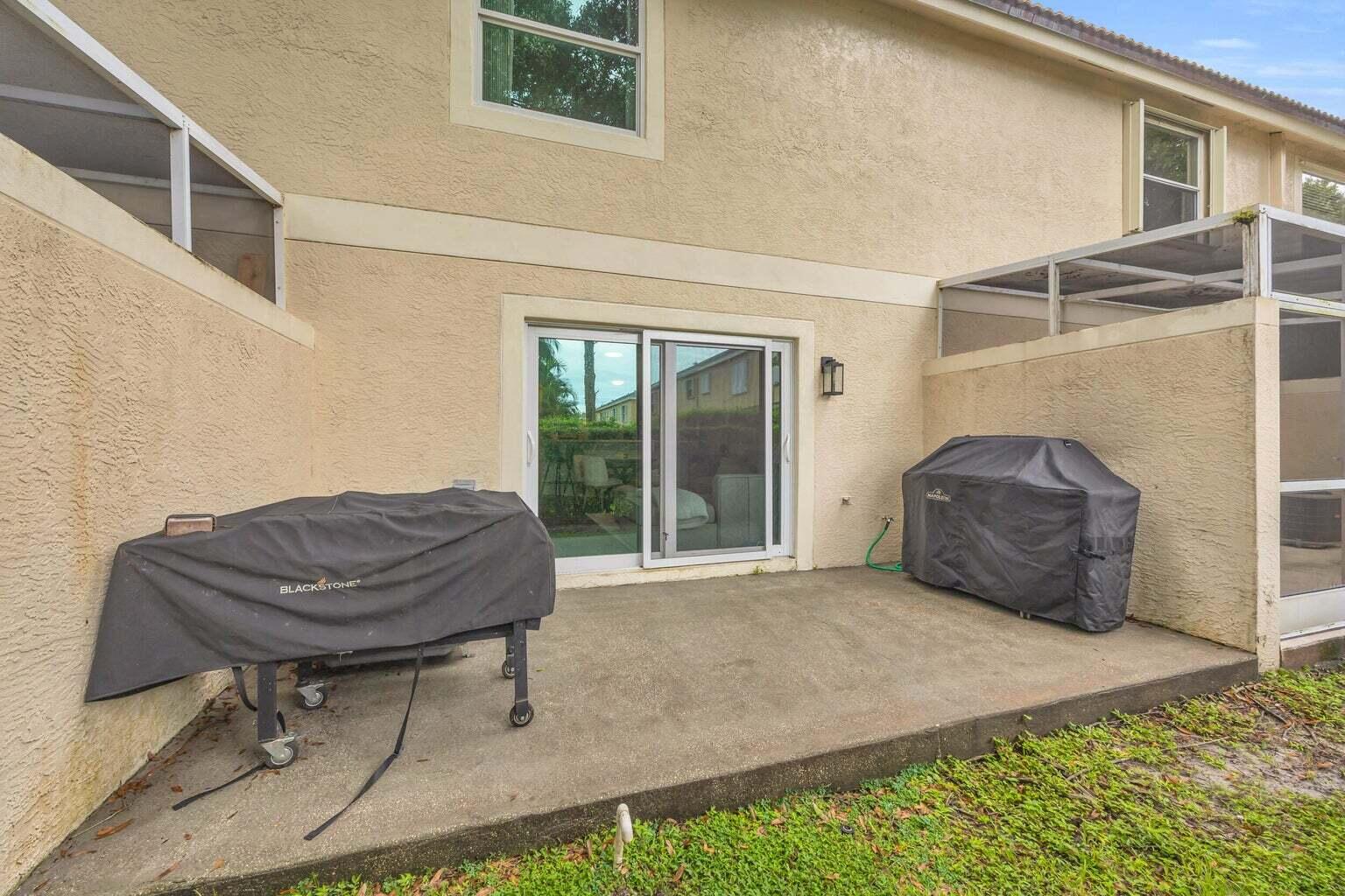 170 Timberwalk Trail Jupiter, FL 33458 - Photo 28 of 28 a bedroom with a bed and a chair
