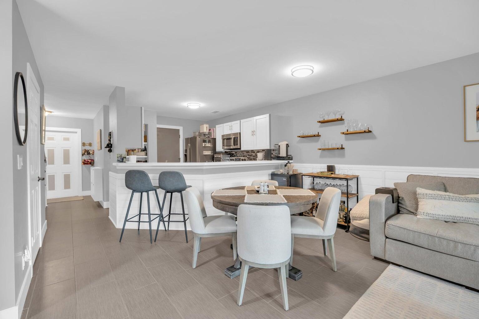 170 Timberwalk Trail Jupiter, FL 33458 - Photo 8 of 28 a dining room with furniture and a kitchen view