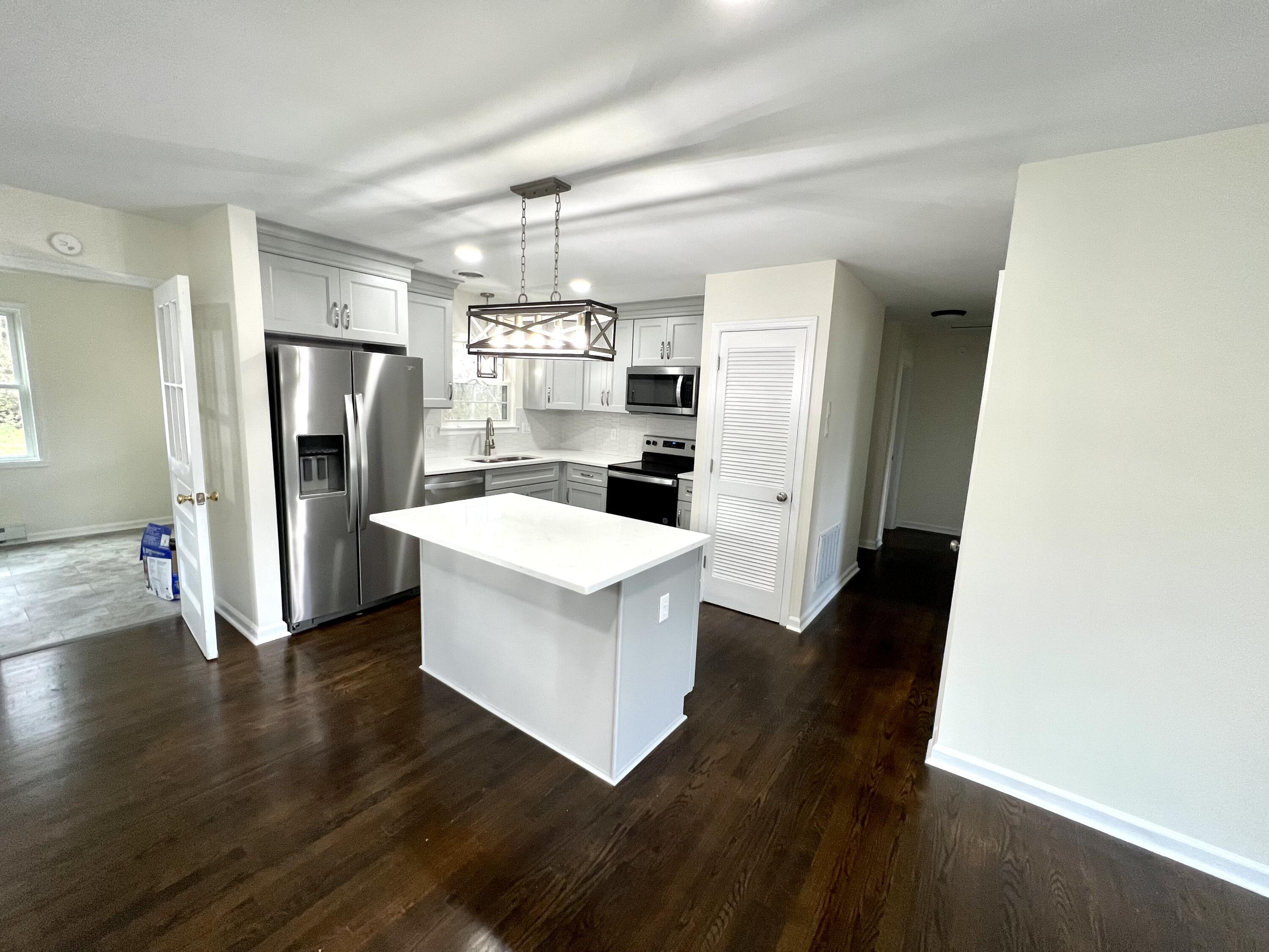 5721 Green Ridge Road Roanoke, VA 24019 - Photo 4 of 16 a kitchen with a refrigerator and a sink